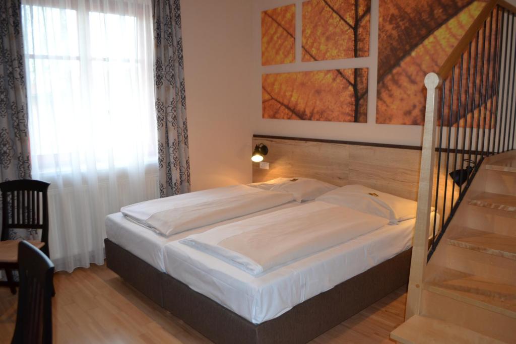 Postel nebo postele na pokoji v ubytování JUFA Hotel Fürstenfeld