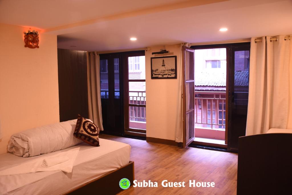 Postel nebo postele na pokoji v ubytování Subha Guest House