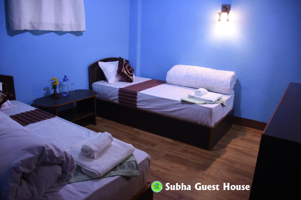 Postel nebo postele na pokoji v ubytování Subha Guest House