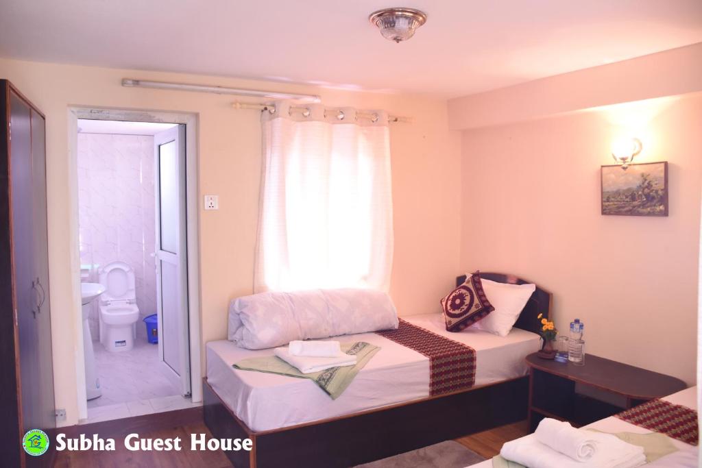 Postel nebo postele na pokoji v ubytování Subha Guest House