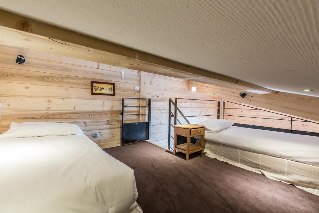 Postel nebo postele na pokoji v ubytování Hôtel Spa Crychar