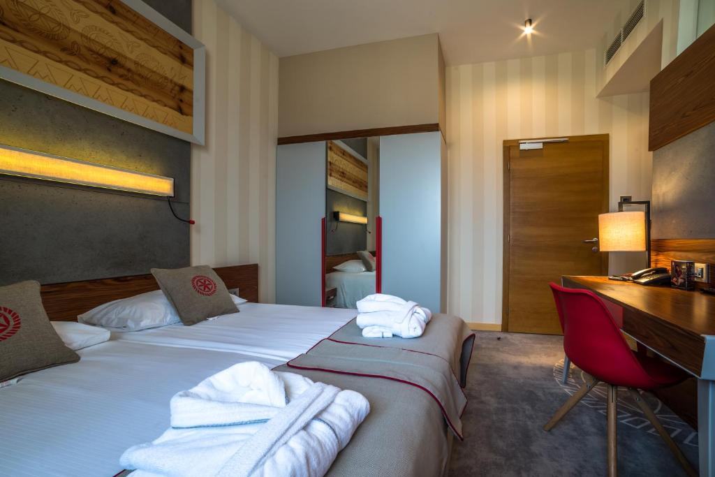 Posteľ alebo postele v izbe v ubytovaní Hotel Kopieniec Fizjo- Med & SPA