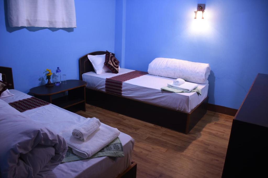 Postel nebo postele na pokoji v ubytování Subha Guest House