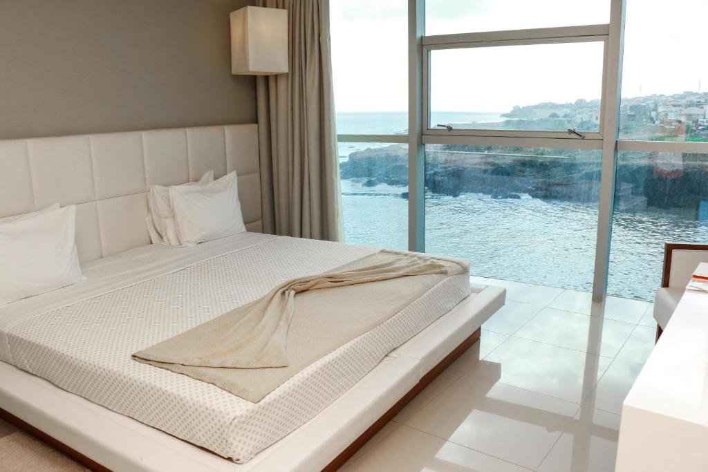 Postel nebo postele na pokoji v ubytování Hotel Vip Praia