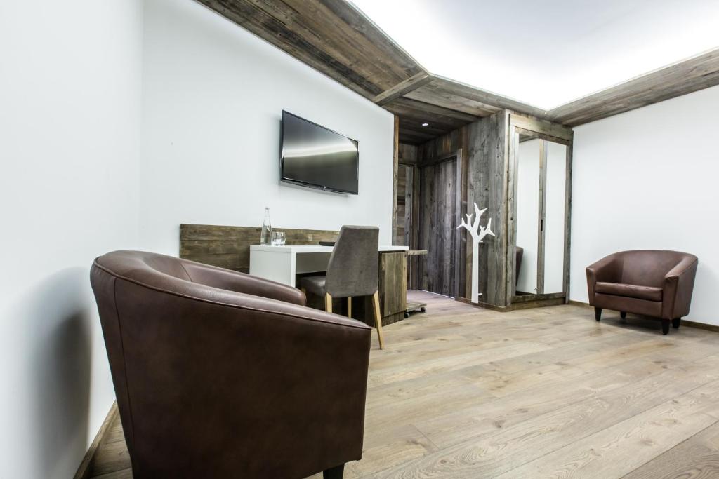 TV a/nebo společenská místnost v ubytování Hôtel Spa Crychar