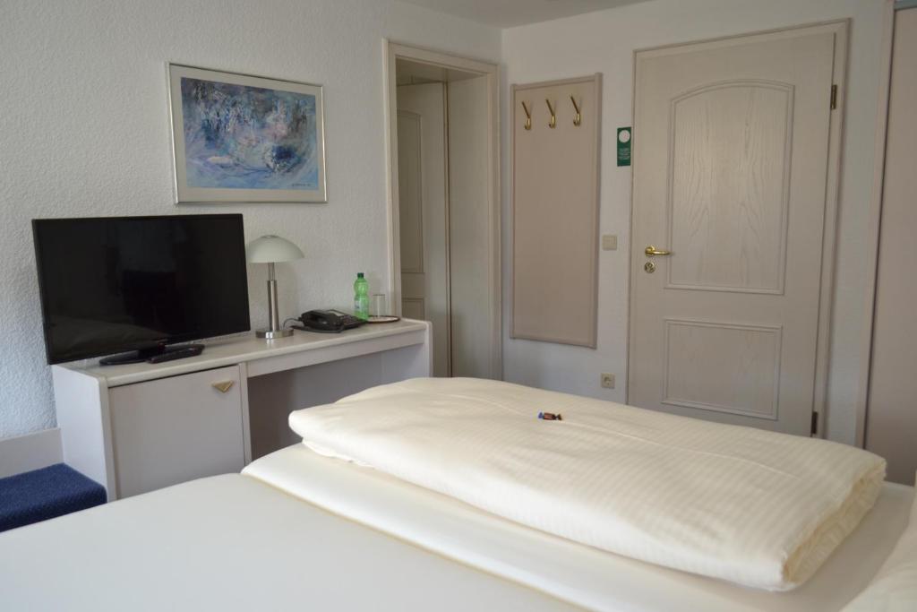 Postel nebo postele na pokoji v ubytování Hotel Zum Lamm