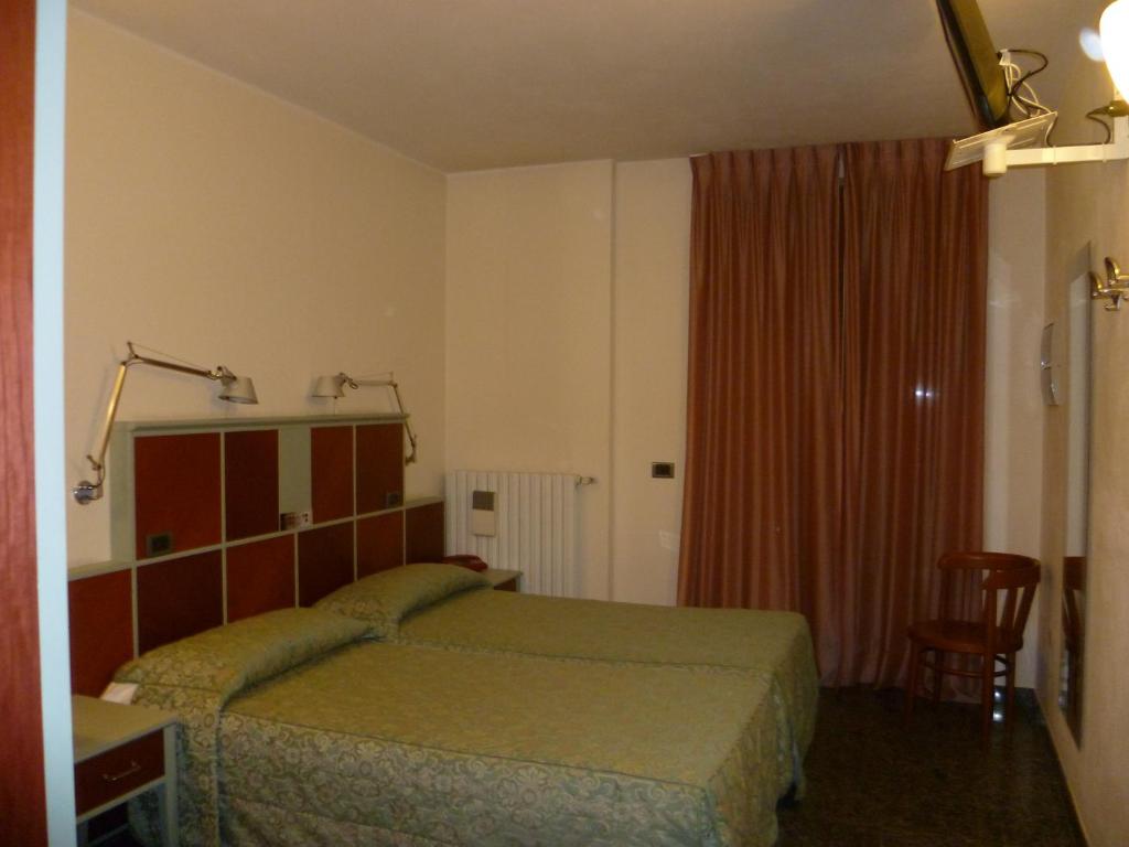 Postel nebo postele na pokoji v ubytování Hotel Derby