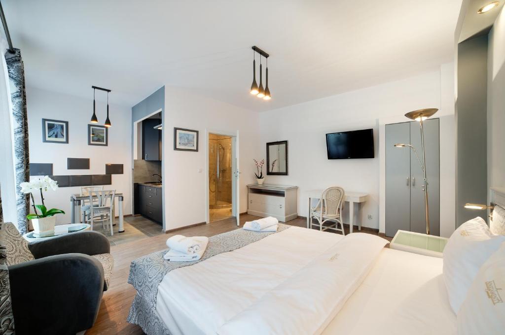 Posteľ alebo postele v izbe v ubytovaní Apartamenty Łozówka