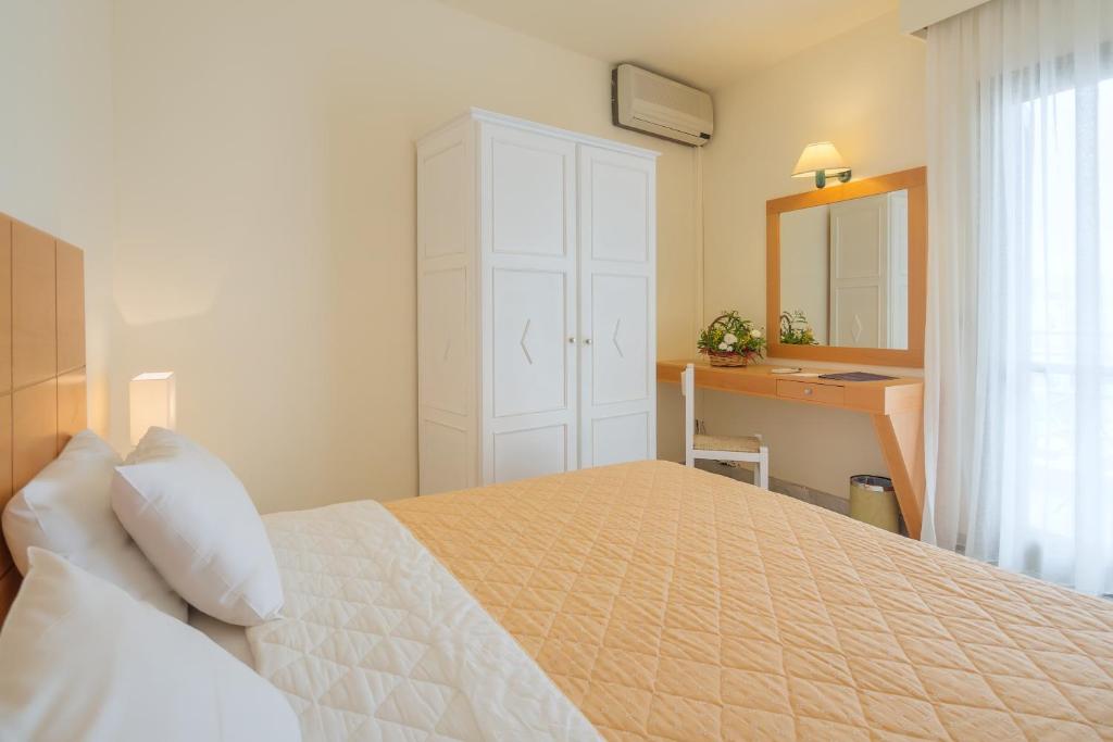 Кровать или кровати в номере Mare Hotel Apartments