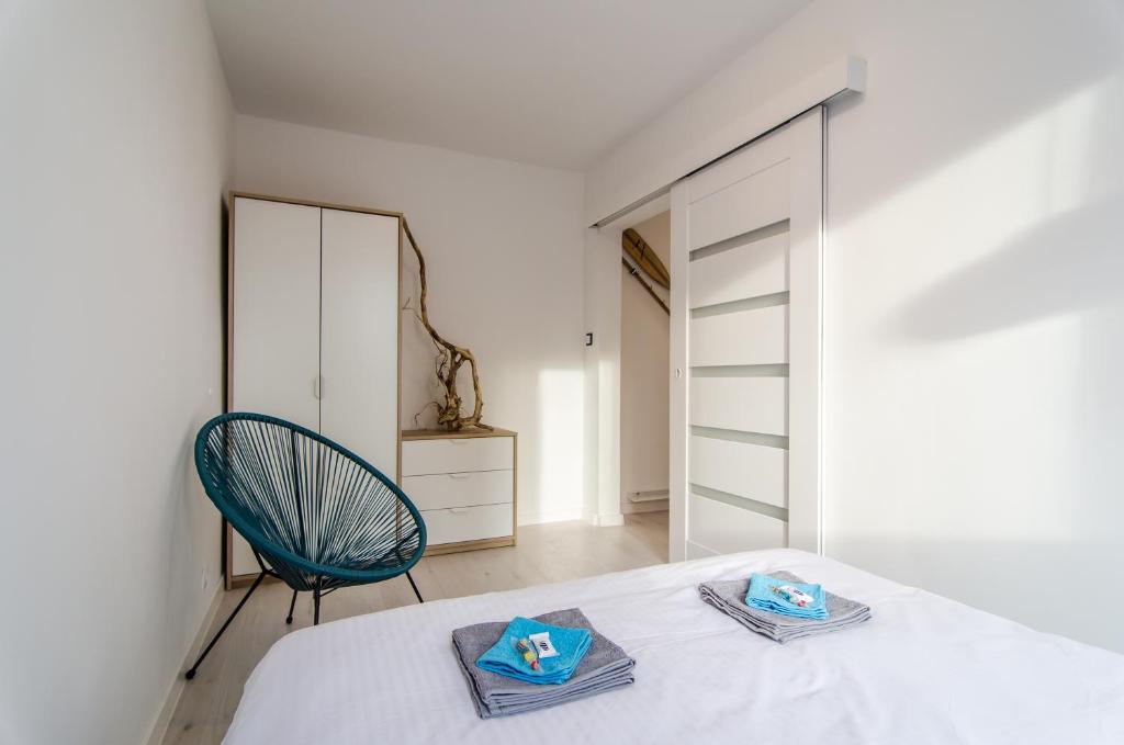 Posteľ alebo postele v izbe v ubytovaní Apartament Szaro na Białym
