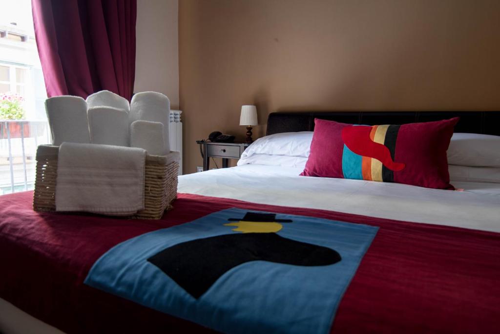 Postel nebo postele na pokoji v ubytování Hotel Plebiscito Aparthotel