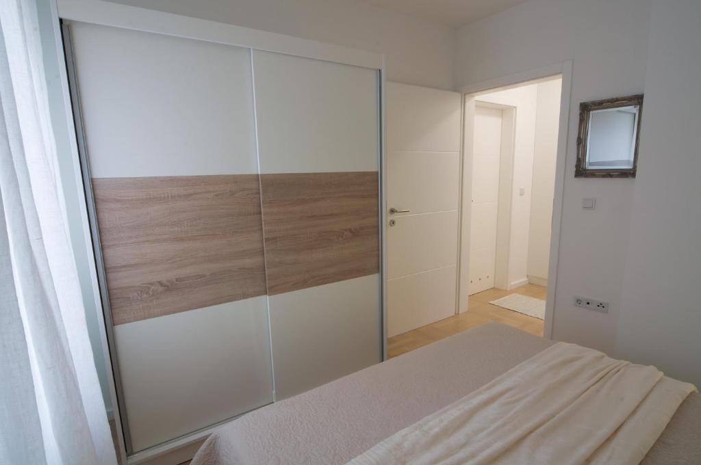 Postel nebo postele na pokoji v ubytování Paula Apartment