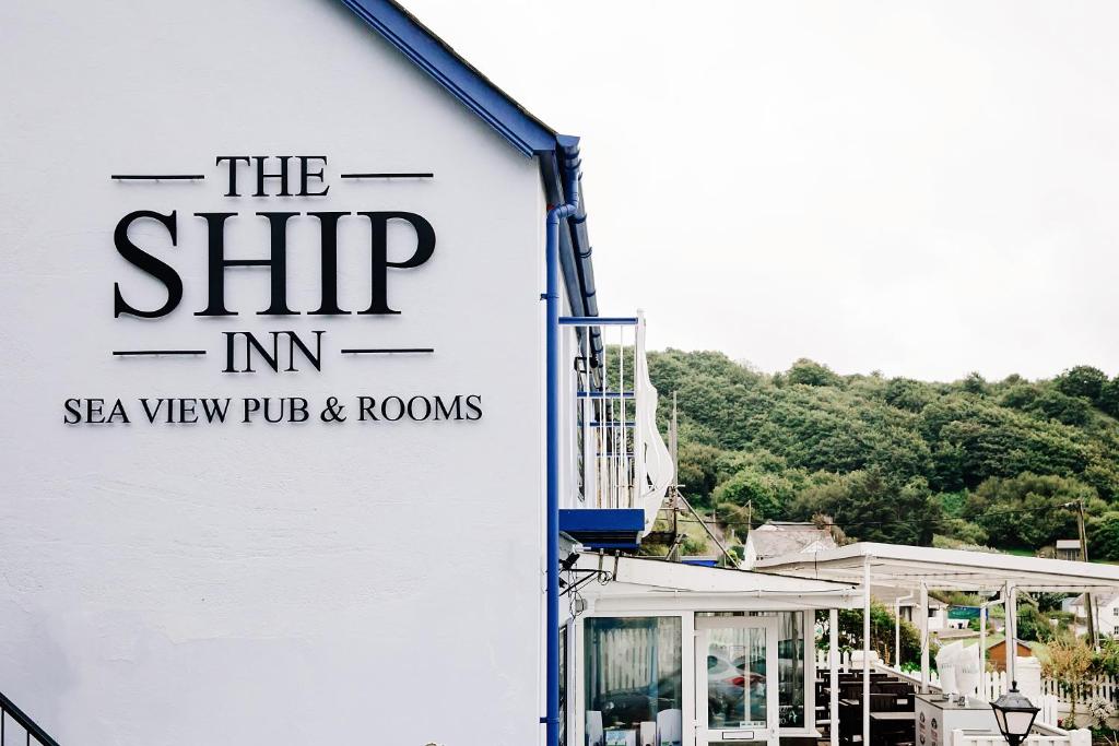 a sign on the side of a building at Ship Inn in Aberporth