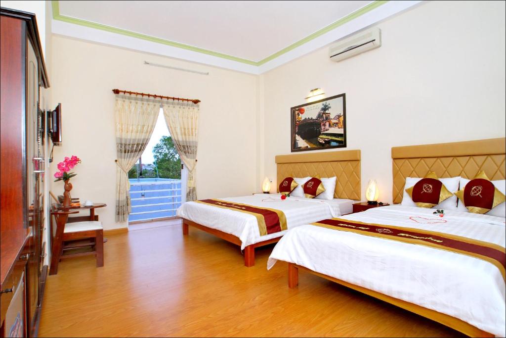 Postel nebo postele na pokoji v ubytování Hoi An Life Villa