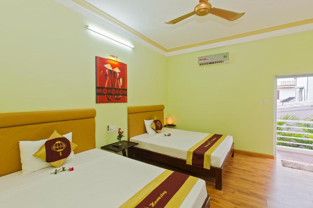 Postel nebo postele na pokoji v ubytování Hoi An Life Villa