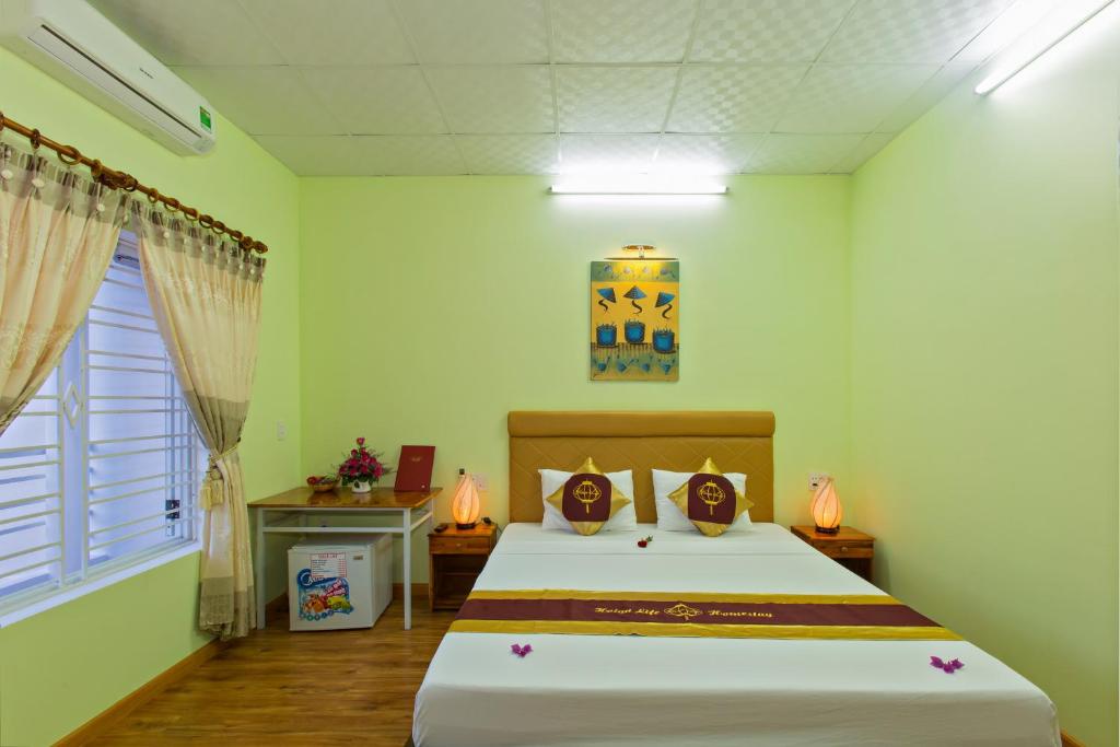 Postel nebo postele na pokoji v ubytování Hoi An Life Villa