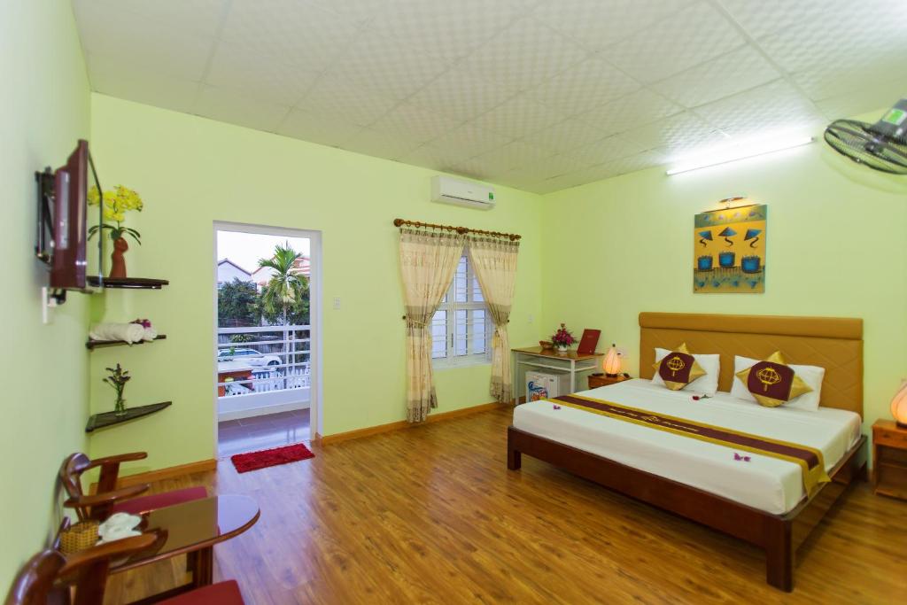 Postel nebo postele na pokoji v ubytování Hoi An Life Villa