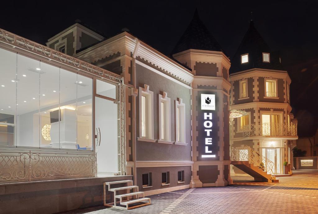 a store front with a sign that reads open at Castello Boutique Hotel in Čačak