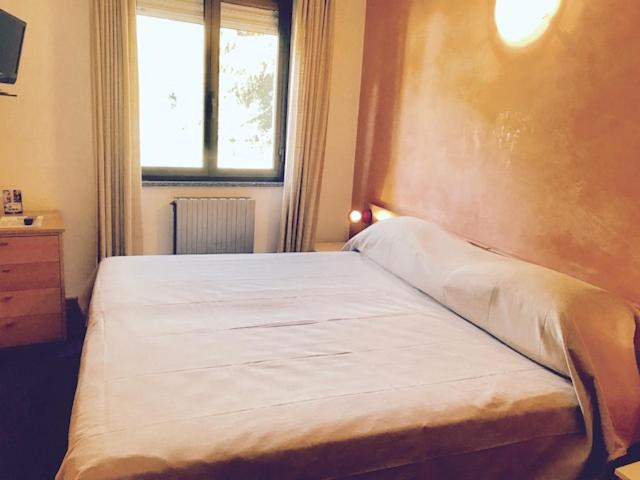 Postel nebo postele na pokoji v ubytování Hotel 2 Magnolie