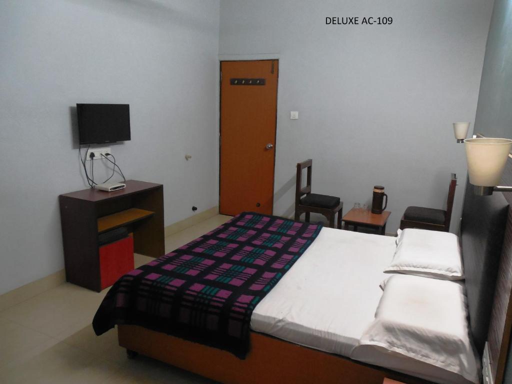 Postel nebo postele na pokoji v ubytování Hotel Silver Springs