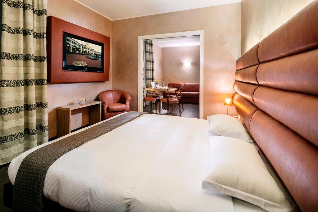 Postel nebo postele na pokoji v ubytování Base Hotel