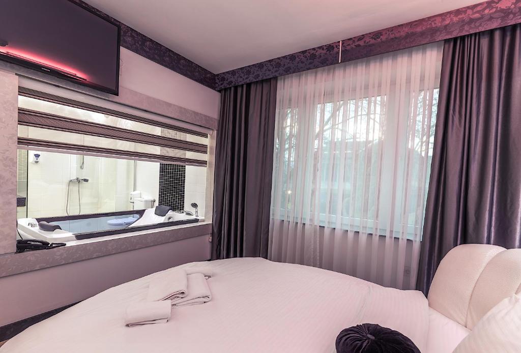 Postel nebo postele na pokoji v ubytování Hotel De KOKA