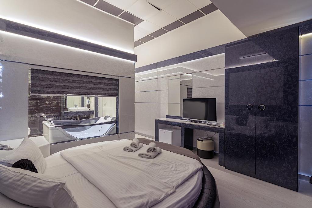Postel nebo postele na pokoji v ubytování Hotel De KOKA