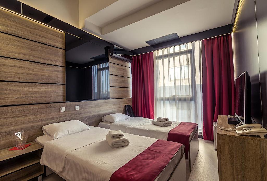 Postel nebo postele na pokoji v ubytování Hotel De KOKA