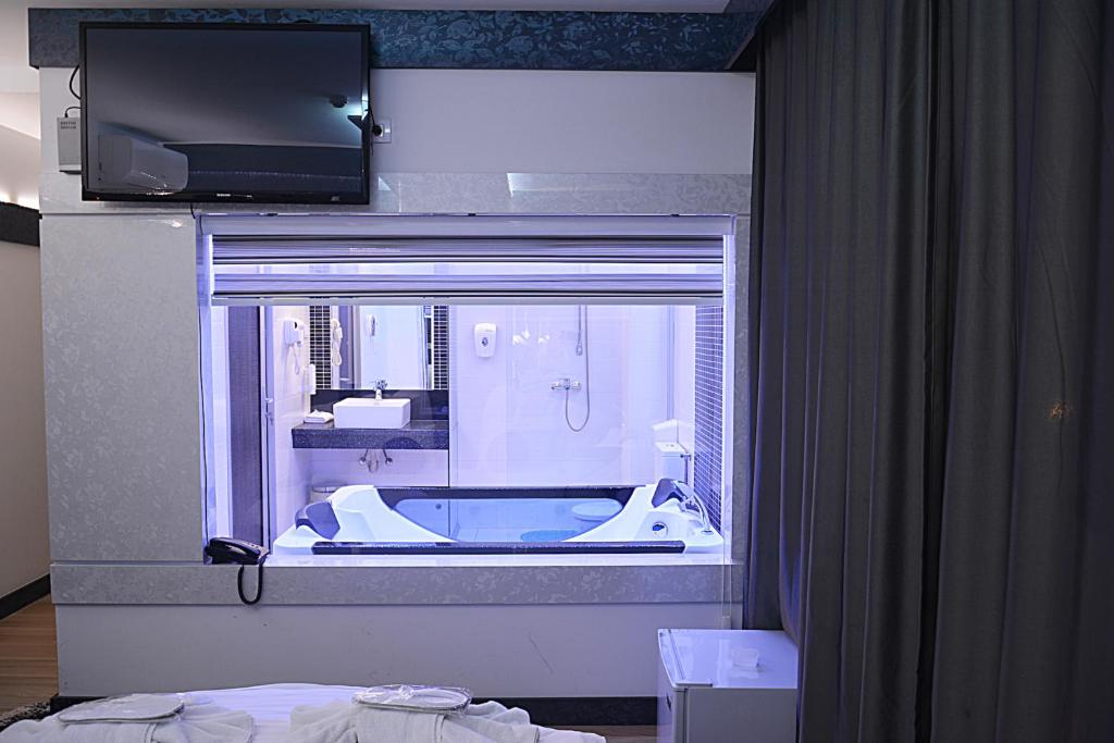 Postel nebo postele na pokoji v ubytování Hotel De KOKA