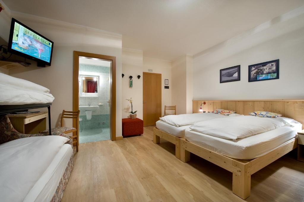 Posteľ alebo postele v izbe v ubytovaní Hotel Alegra