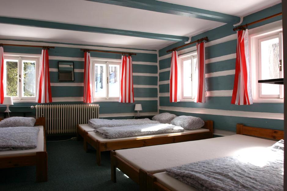 Postel nebo postele na pokoji v ubytování Jeleni chata Skladanka