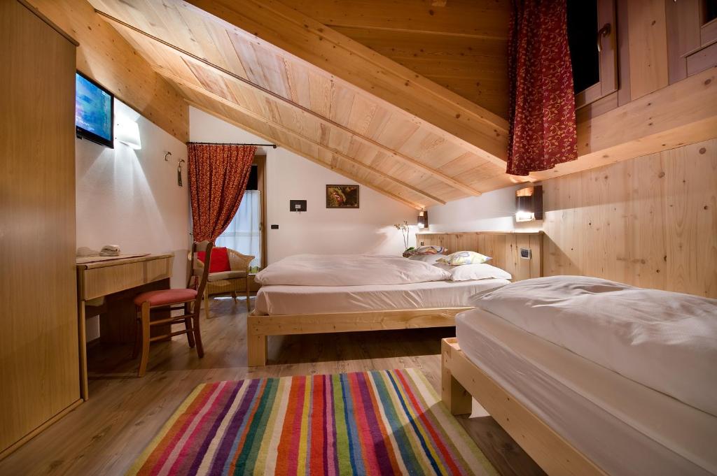 Posteľ alebo postele v izbe v ubytovaní Hotel Alegra