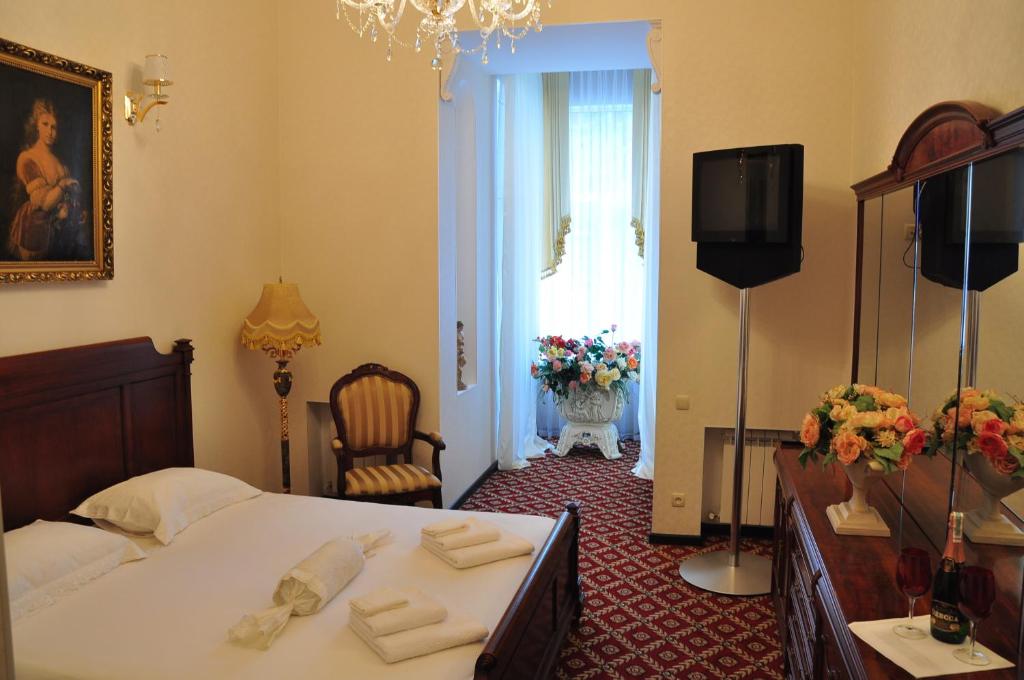 Postel nebo postele na pokoji v ubytování Queen Valery Hotel