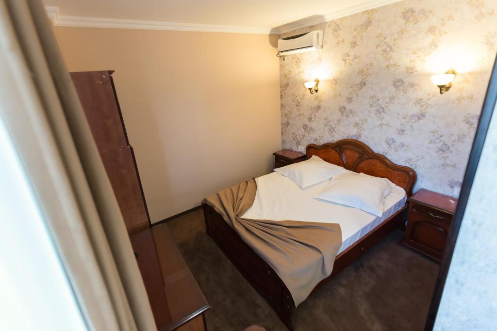 Postel nebo postele na pokoji v ubytování Express Residence