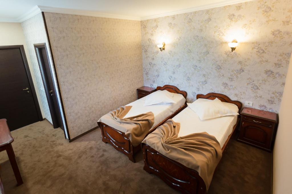 Postel nebo postele na pokoji v ubytování Express Residence