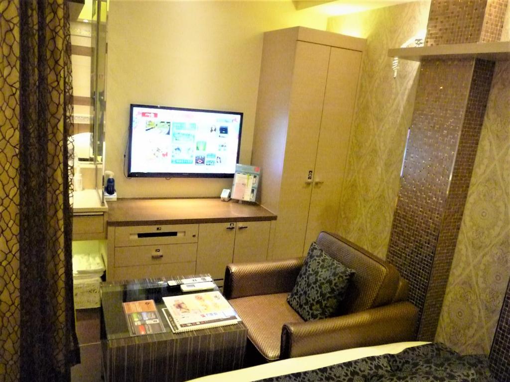 TV a/nebo společenská místnost v ubytování Hotel Lei
