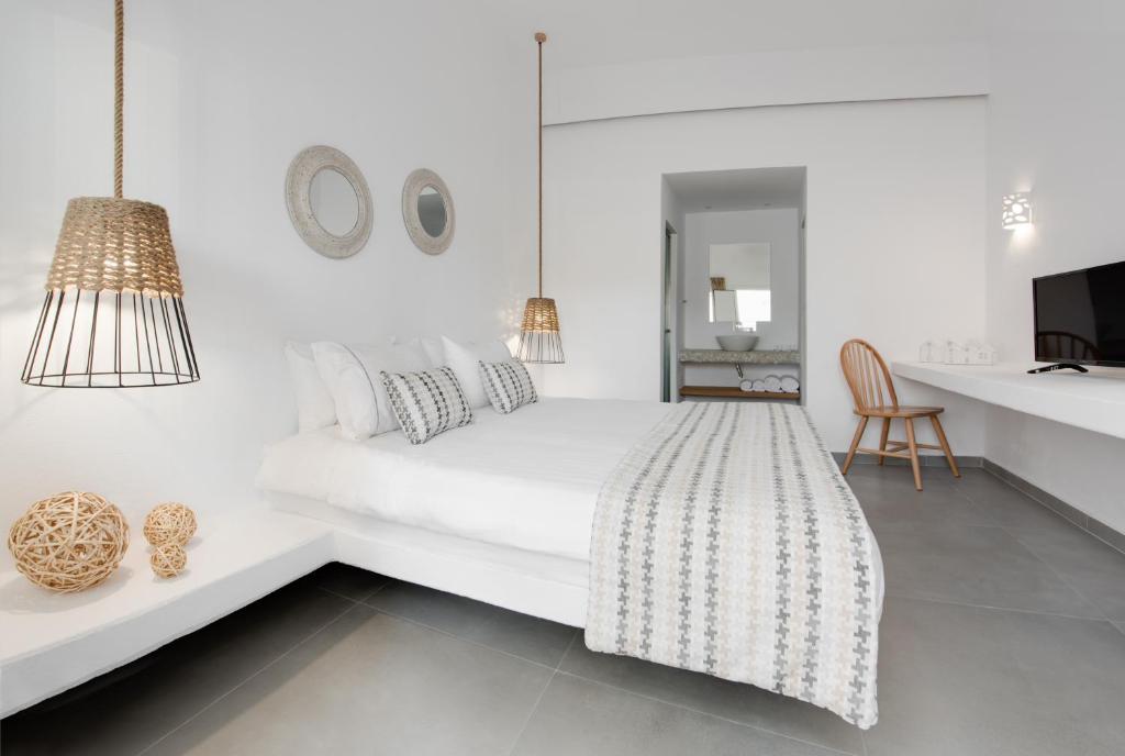 Łóżko lub łóżka w pokoju w obiekcie Hotel Eucalyptus