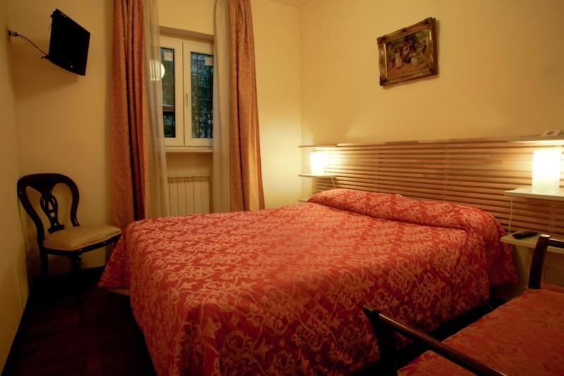 Łóżko lub łóżka w pokoju w obiekcie Affittacamere Villa Wilson
