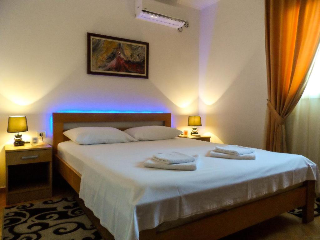 Postel nebo postele na pokoji v ubytování Apartments MileS