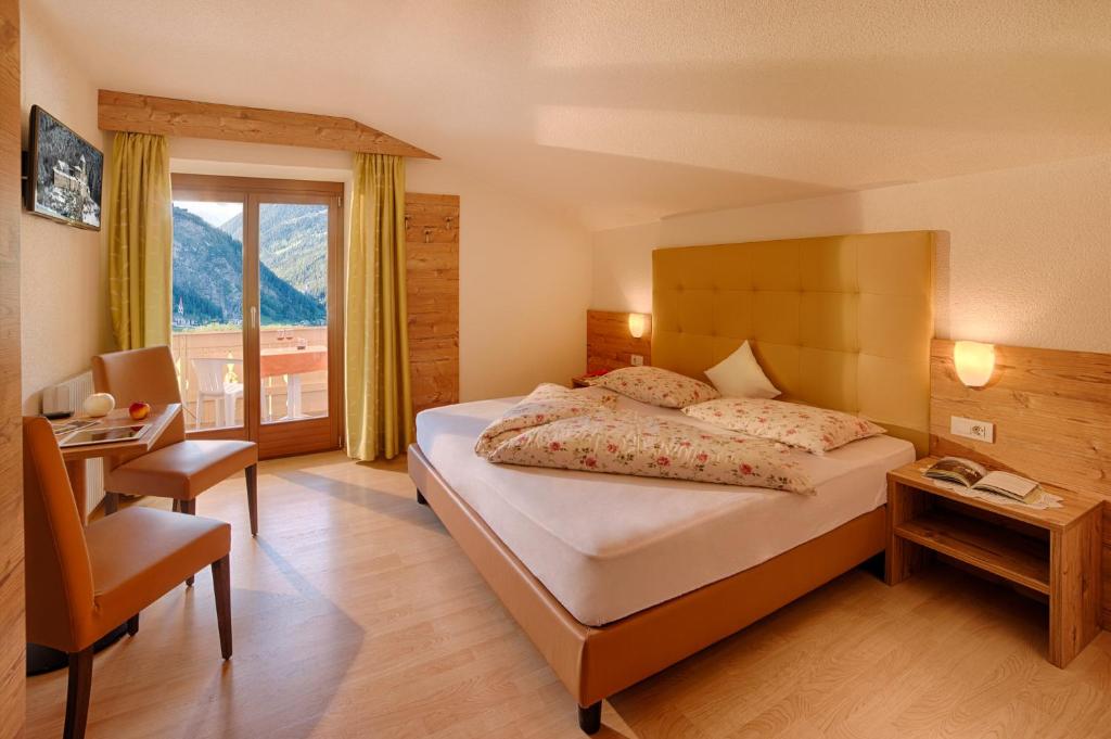 Postel nebo postele na pokoji v ubytování Hotel Mair
