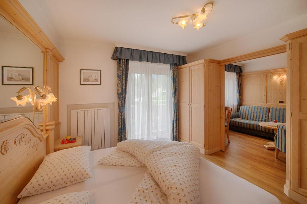 Postel nebo postele na pokoji v ubytování Hotel Mair