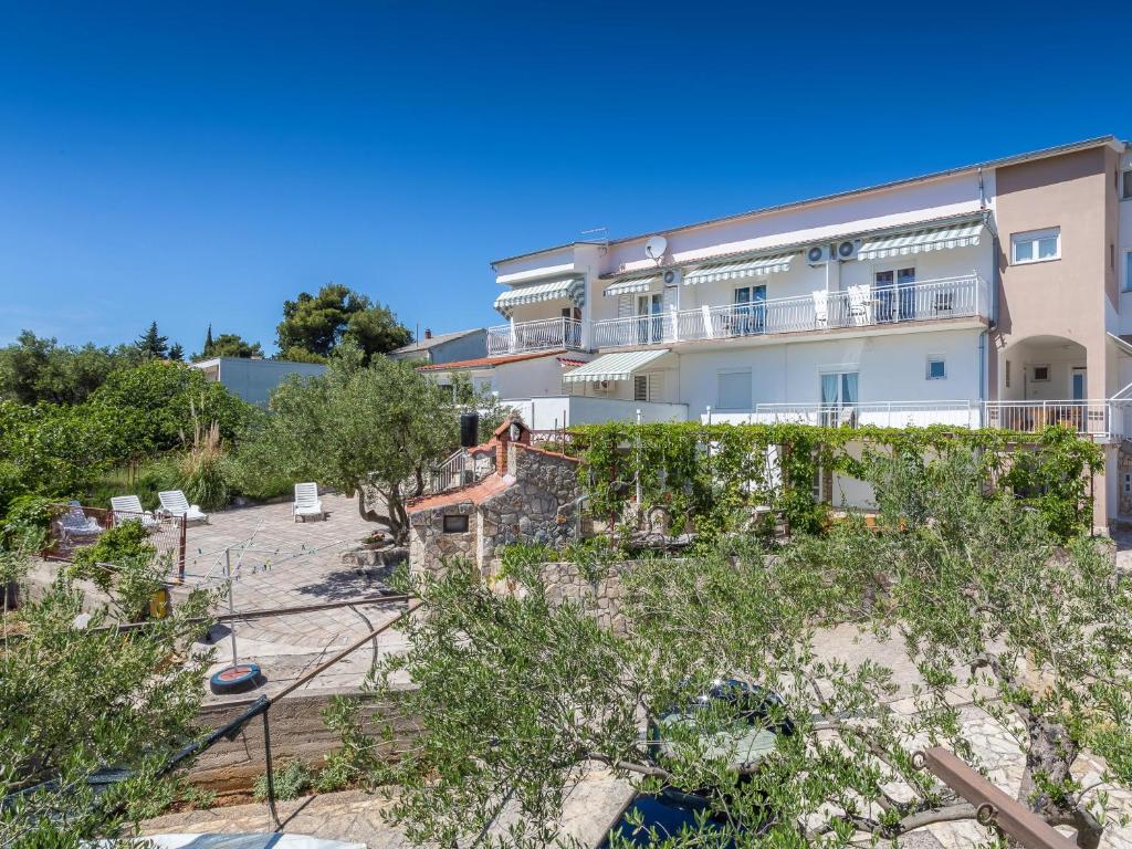 a view of a building from the beach at Apartments Antea & Magdalena in Pirovac