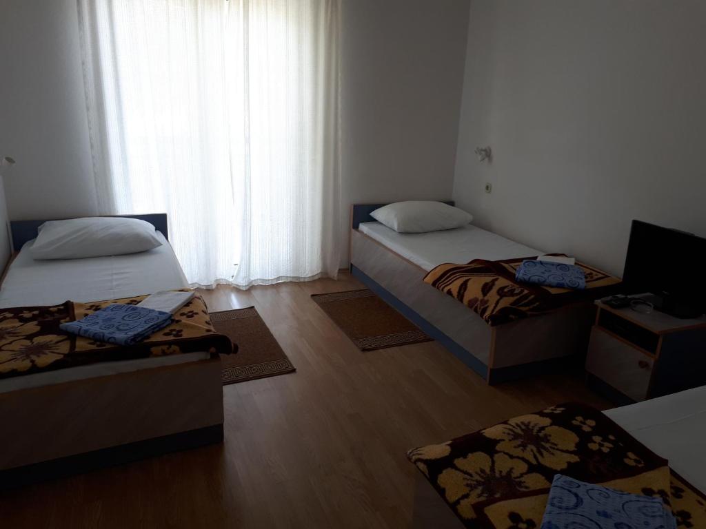 Posteľ alebo postele v izbe v ubytovaní Guest House & Restaurant Adriatic Klek