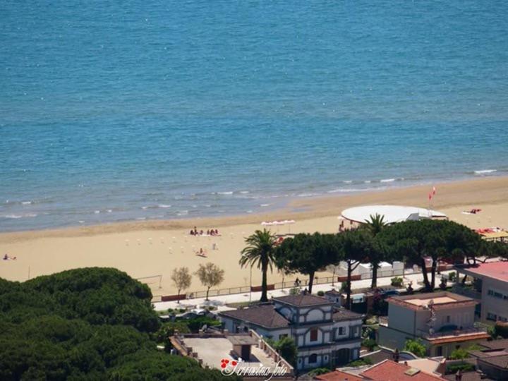 a view of a beach with people on the sand at Domus in Terracina