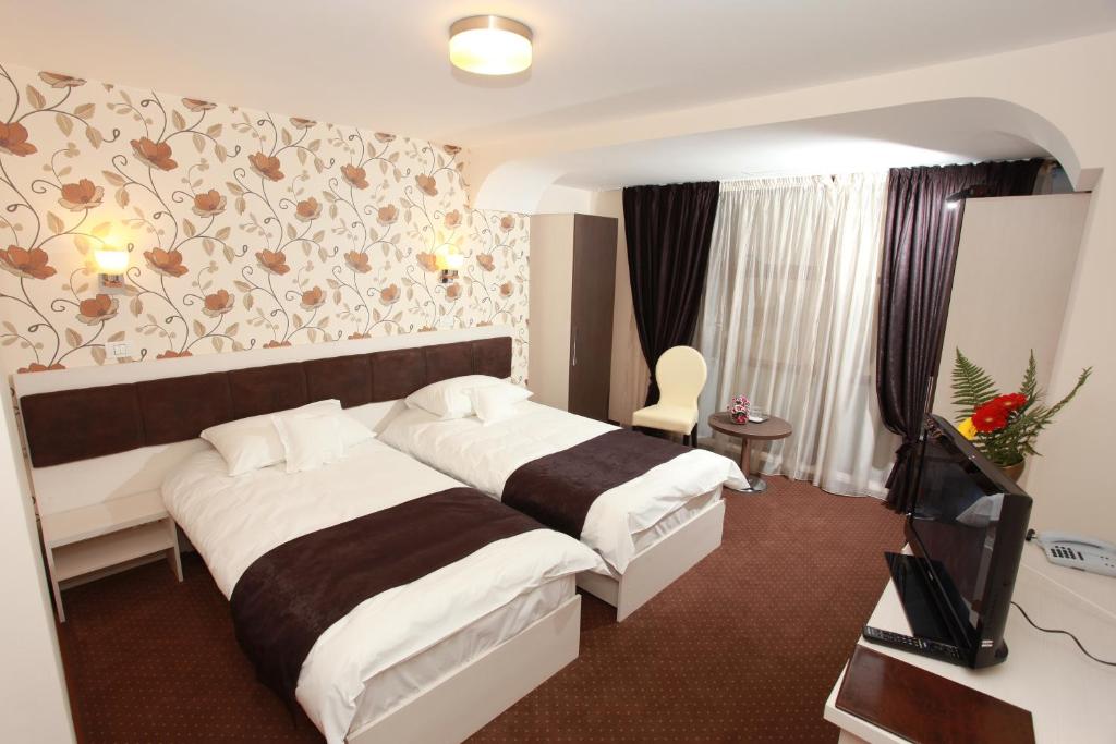 Voodi või voodid majutusasutuse West Plaza Hotel toas