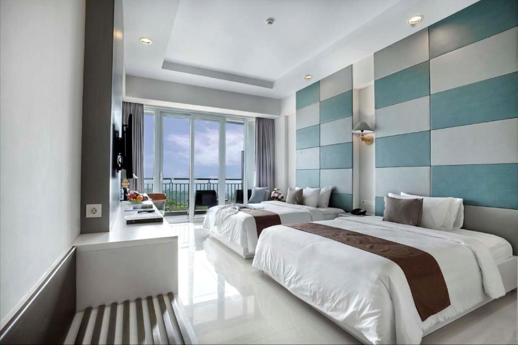 A bed or beds in a room at R Hotel Rancamaya