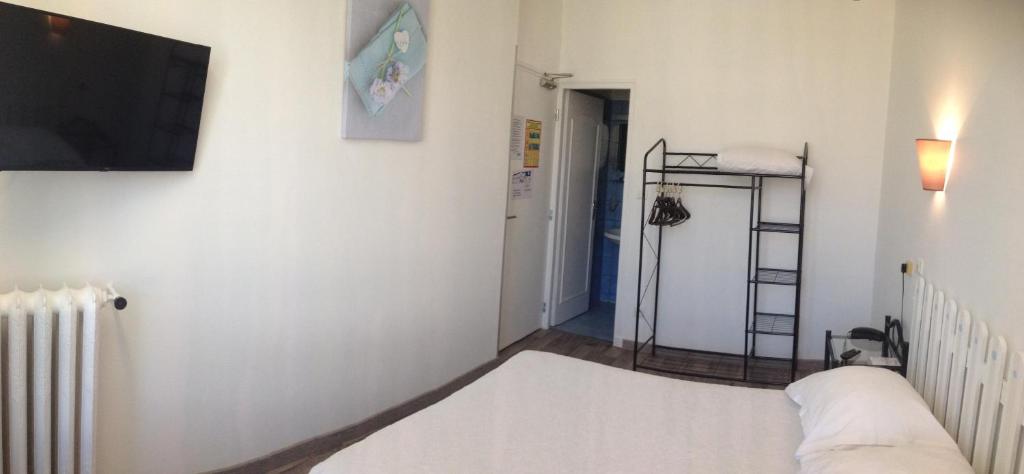 Postel nebo postele na pokoji v ubytování Au Nouvel Hôtel