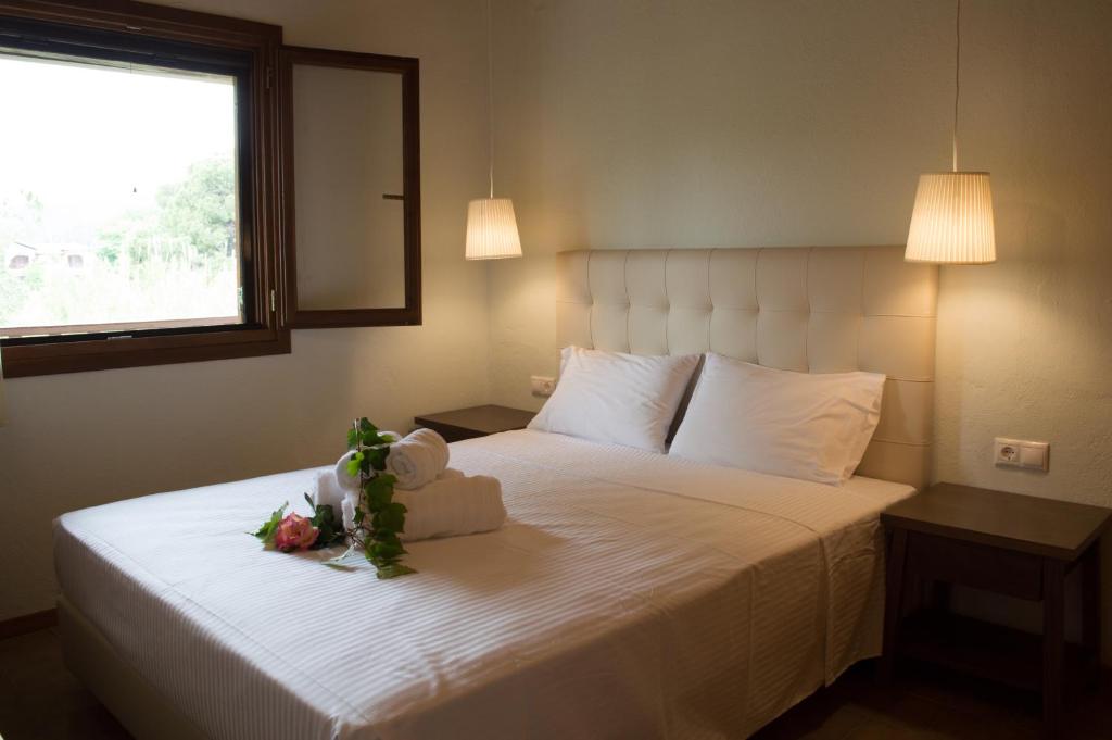 Ένα ή περισσότερα κρεβάτια σε δωμάτιο στο Aegialis Apartments (Dimitros)