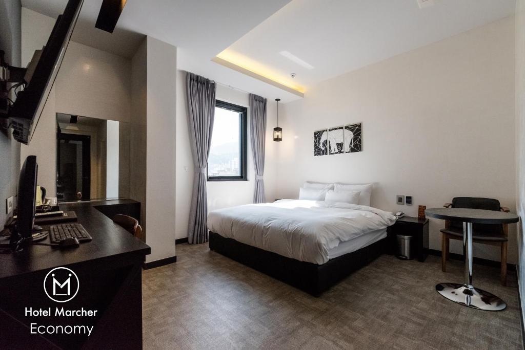 Postel nebo postele na pokoji v ubytování Hotel Marcher