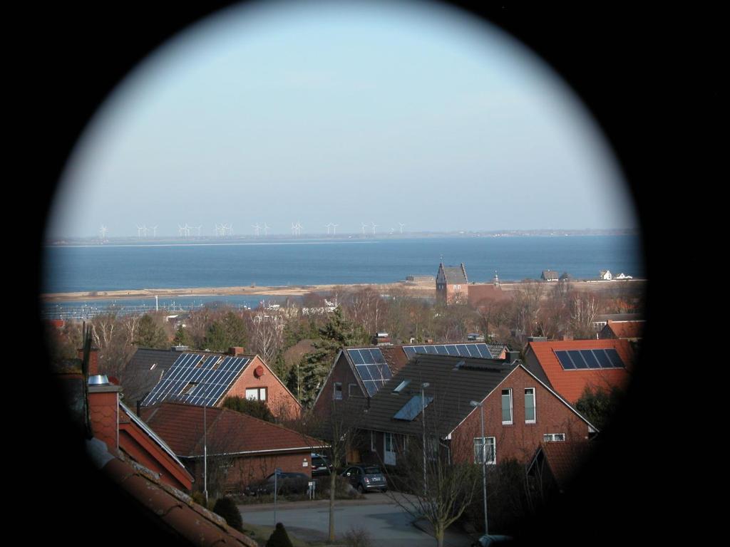 a view of a town with houses and the water at Haus über den Dächern von Heiligenhafen in Heiligenhafen